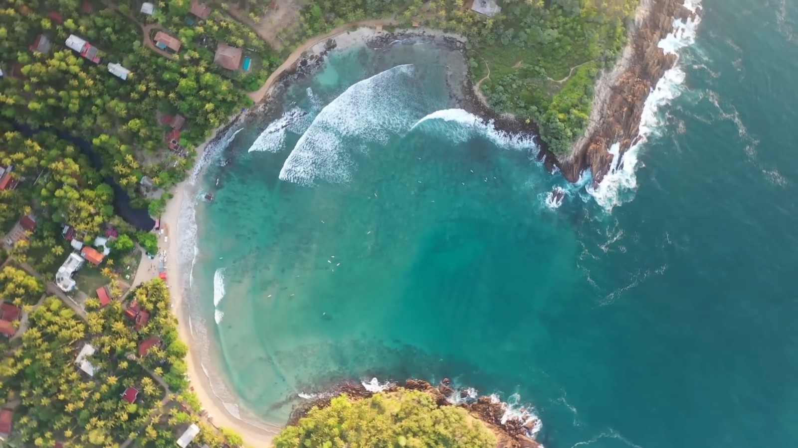 Aerial view of a turquoise cove and beach on the Sri Lanka coast